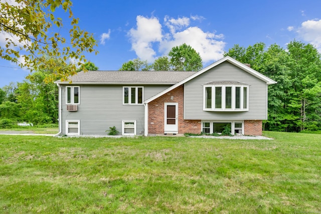 18 Hillcrest Dr, Somers, CT 06071 - raised ranch featuring a front yard and brick siding