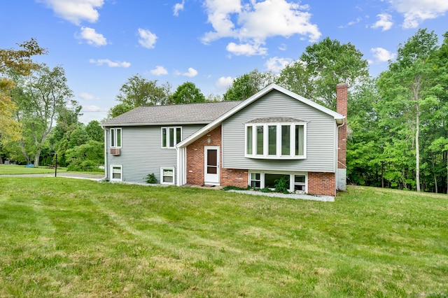 18 Hillcrest Dr, Somers, CT 06071 - raised ranch with a chimney, a front lawn, and brick siding