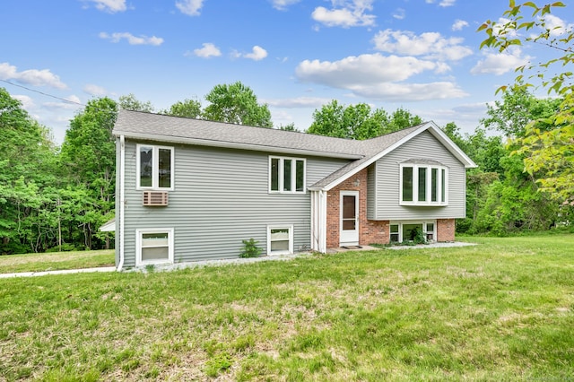 18 Hillcrest Dr, Somers, CT 06071 - bi-level home featuring a front lawn and brick siding