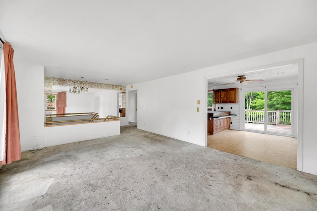 18 Hillcrest Dr, Somers, CT 06071 - unfurnished living room featuring light carpet and a ceiling fan
