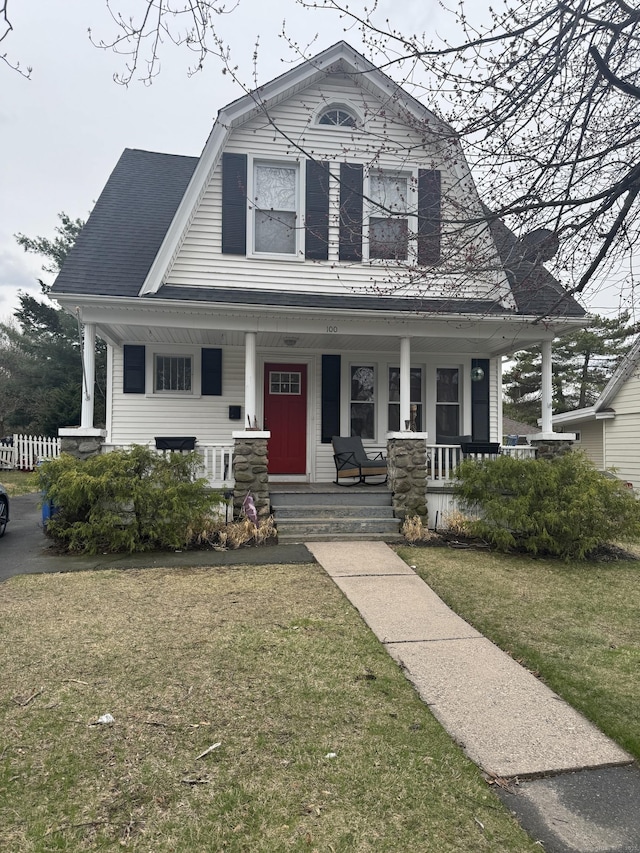100 Ridgefield Ave, Waterbury, CT 06705 - colonial inspired home with covered porch, a gambrel roof, and a front yard