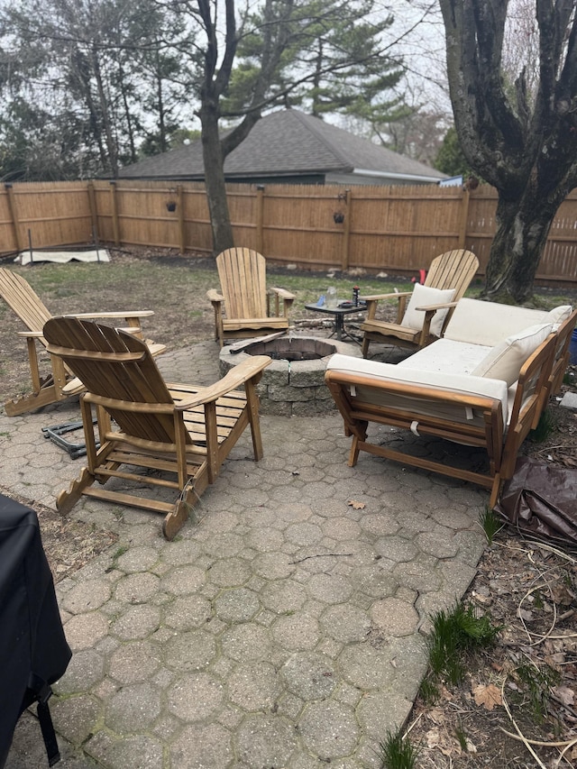 100 Ridgefield Ave, Waterbury, CT 06705 - fenced backyard with a fire pit and a patio area