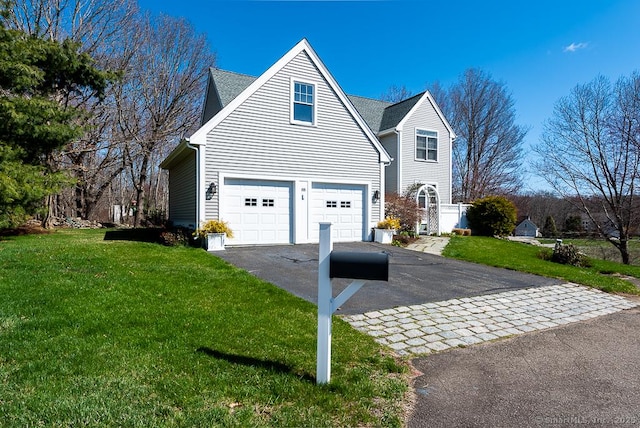 88 Sconset Ln, Guilford, CT 06437 - view of property exterior with a yard, driveway, and a garage