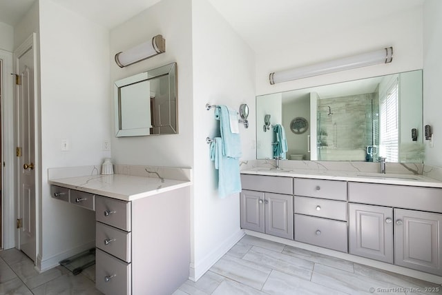 88 Sconset Ln, Guilford, CT 06437 - full bathroom with double vanity, a tile shower, baseboards, and a sink