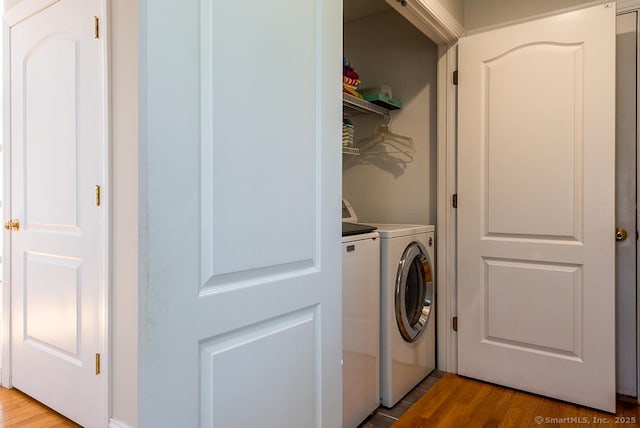 88 Sconset Ln, Guilford, CT 06437 - washroom featuring laundry area, washing machine and dryer, and light wood-type flooring
