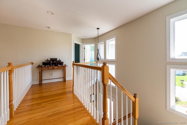 88 Sconset Ln, Guilford, CT 06437 - corridor with an upstairs landing, light wood-type flooring, and baseboards