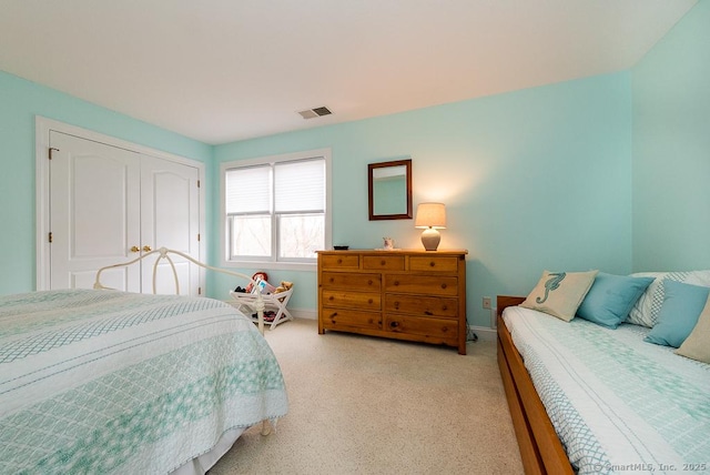 88 Sconset Ln, Guilford, CT 06437 - bedroom with visible vents, baseboards, a closet, and light carpet
