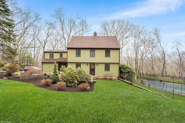 20 Sunrise Trl, East Lyme, CT 06333 - back of house featuring a chimney, roof with shingles, and a swimming pool