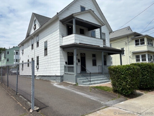 17-19 Fenwick St, Hartford, CT 06114 - view of front of property with covered porch and a balcony