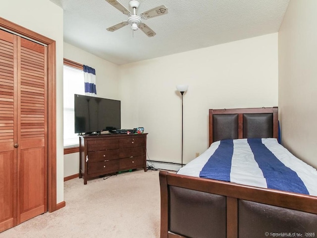 17-19 Fenwick St, Hartford, CT 06114 - bedroom featuring light carpet, a baseboard heating unit, a ceiling fan, baseboards, and a closet