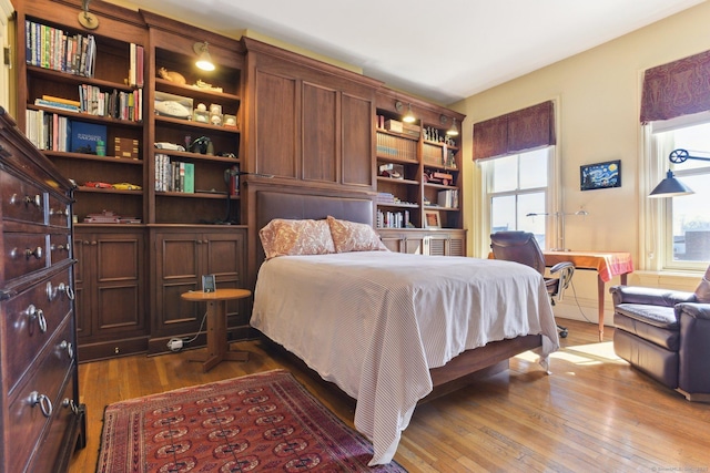 bedroom featuring dark wood finished floors