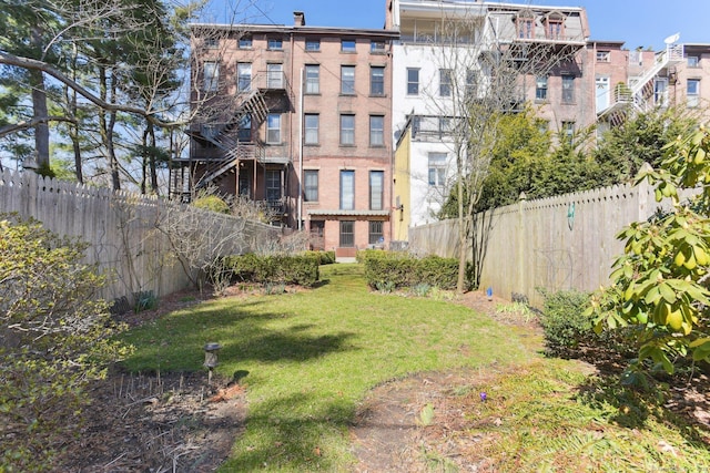 view of yard with a fenced backyard