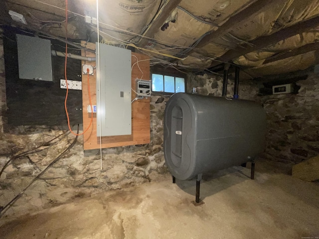 basement featuring heating fuel and electric panel