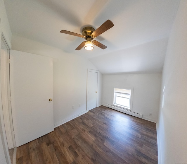 additional living space featuring wood finished floors, lofted ceiling, a baseboard heating unit, and ceiling fan