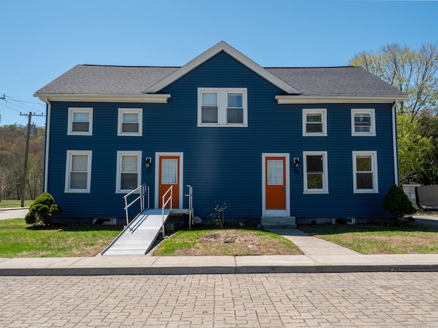 view of front of property with a shingled roof and entry steps