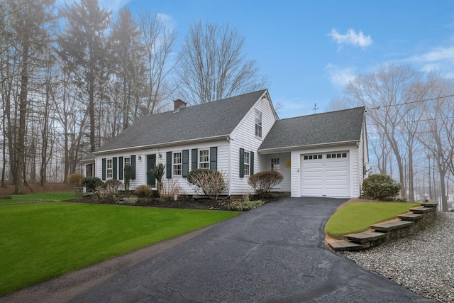 cape cod home featuring a front yard, a shingled roof, a garage, aphalt driveway, and a chimney