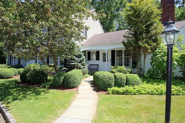 125 Silver Spring Rd, Fairfield, CT 06824 - obstructed view of property with a front lawn and a shingled roof