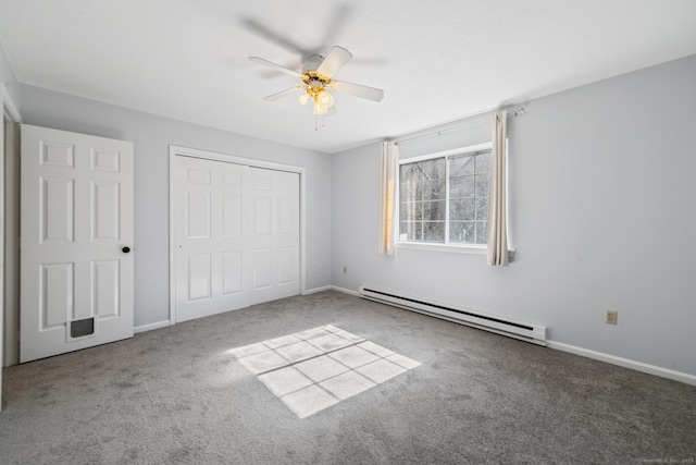 unfurnished bedroom featuring carpet floors, baseboards, a closet, and a baseboard heating unit