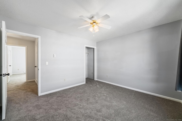 unfurnished bedroom featuring baseboards, carpet, and a textured ceiling