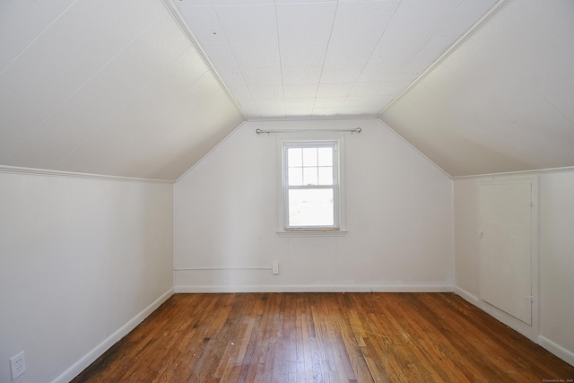 bonus room with baseboards, lofted ceiling, and hardwood / wood-style flooring