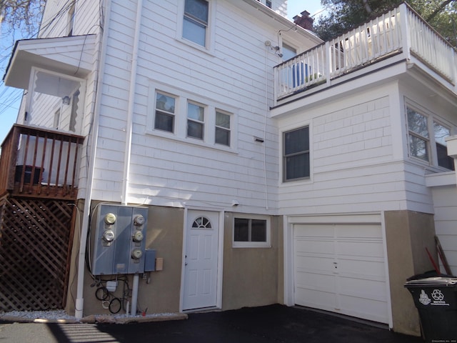 426 Courtland Ave Apt 1, Stamford, CT 06906 - rear view of house with a balcony and an attached garage