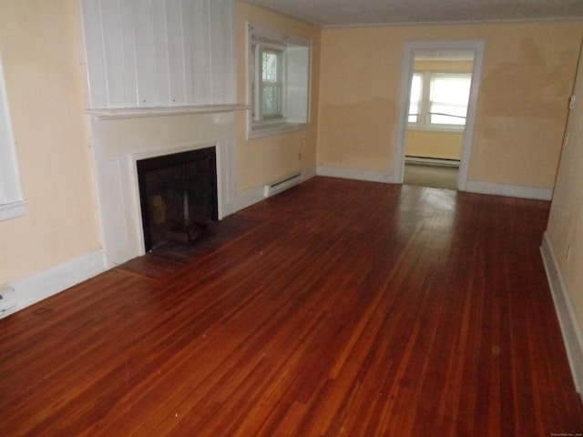 426 Courtland Ave Apt 1, Stamford, CT 06906 - unfurnished living room featuring a fireplace, a baseboard radiator, wood finished floors, ornamental molding, and baseboards