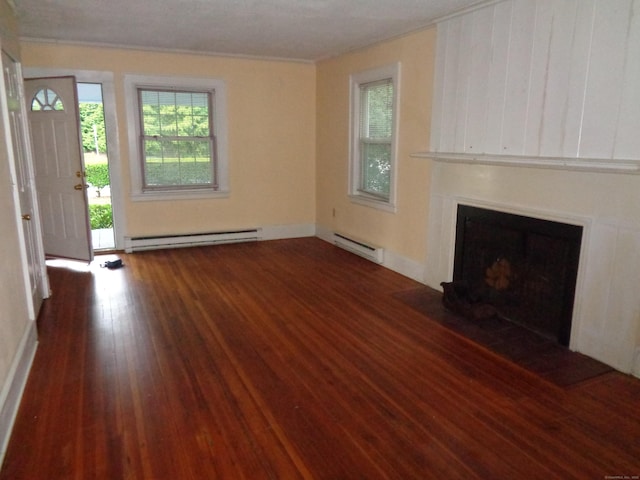 426 Courtland Ave Apt 1, Stamford, CT 06906 - unfurnished living room featuring baseboard heating, crown molding, wood finished floors, a fireplace with flush hearth, and baseboards