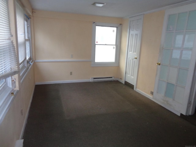 426 Courtland Ave Apt 1, Stamford, CT 06906 - unfurnished room with a baseboard heating unit, baseboards, and dark carpet