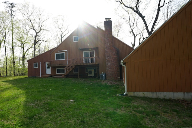 953 Rainbow Trl, Orange, CT 06477 - back of house featuring stairs, a lawn, a chimney, and a wooden deck