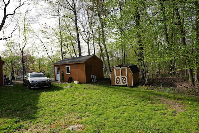 953 Rainbow Trl, Orange, CT 06477 - view of green lawn with a storage shed and an outbuilding