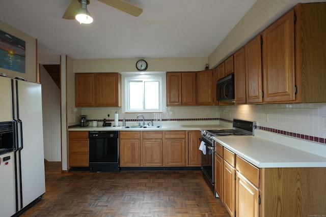 953 Rainbow Trl, Orange, CT 06477 - kitchen with black appliances, a sink, backsplash, light countertops, and brown cabinetry