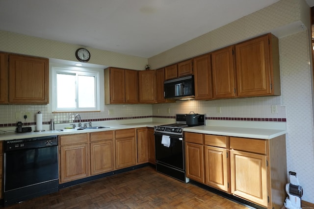 953 Rainbow Trl, Orange, CT 06477 - kitchen featuring black appliances, wallpapered walls, a sink, light countertops, and brown cabinetry