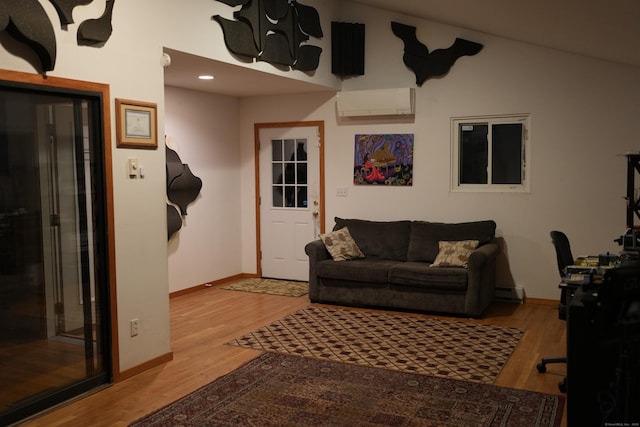 953 Rainbow Trl, Orange, CT 06477 - living room featuring a wall mounted air conditioner, baseboards, and wood finished floors