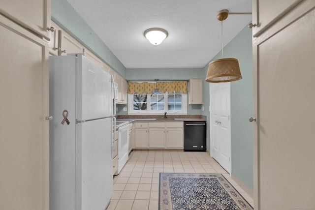 kitchen with white appliances, light tile patterned floors, a textured ceiling, dark countertops, and pendant lighting