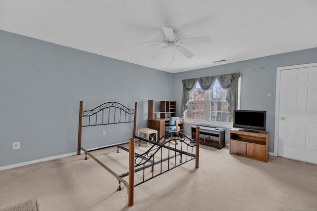 bedroom featuring light carpet, baseboards, a ceiling fan, and visible vents