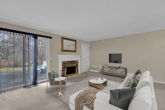 carpeted living room featuring a fireplace with flush hearth, baseboards, and ornamental molding