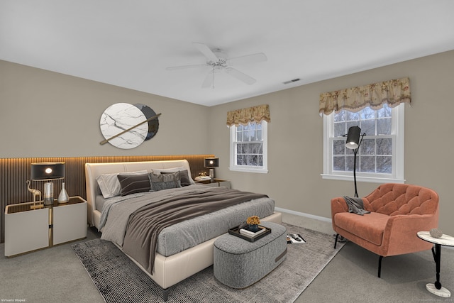 bedroom featuring carpet flooring, baseboards, a ceiling fan, and visible vents