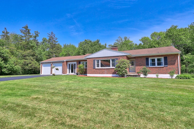 17 Straitsville Rd, Prospect, CT 06712 - ranch-style home featuring brick siding, driveway, an attached garage, and a front yard