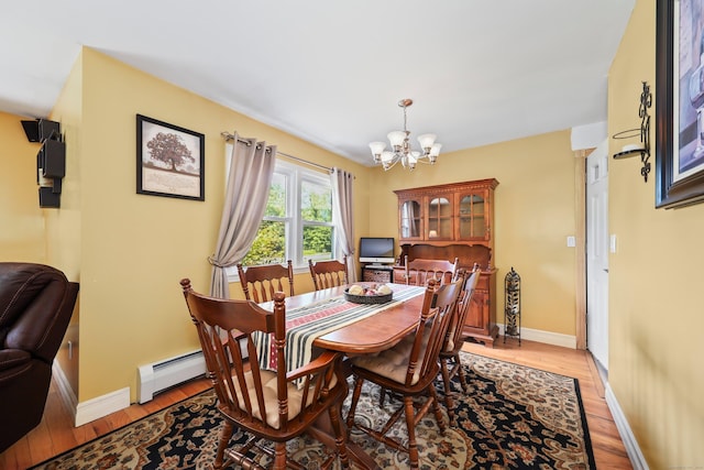 17 Straitsville Rd, Prospect, CT 06712 - dining area with a chandelier, baseboard heating, baseboards, and light wood-type flooring