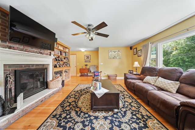 17 Straitsville Rd, Prospect, CT 06712 - living room with wood finished floors, ceiling fan, a brick fireplace, and baseboards