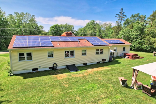 17 Straitsville Rd, Prospect, CT 06712 - back of house with roof mounted solar panels, a yard, and a chimney