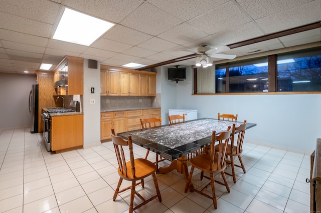 41 Seeley Rd, Trumbull, CT 06611 - dining space with ceiling fan, a drop ceiling, and light tile patterned flooring