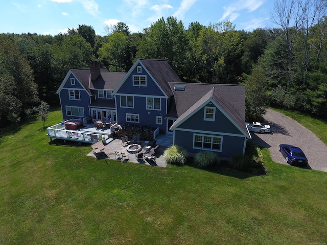 65 Joes Hill Rd, Danbury, CT 06811 - rear view of property featuring an outdoor fire pit, a forest view, a deck, and a yard