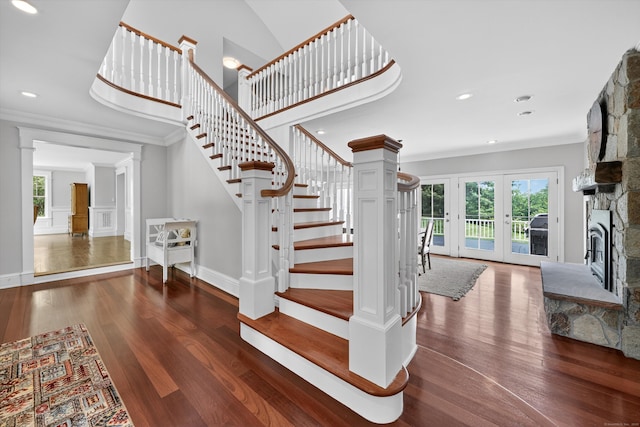 65 Joes Hill Rd, Danbury, CT 06811 - staircase with wood finished floors, ornamental molding, a fireplace, recessed lighting, and french doors