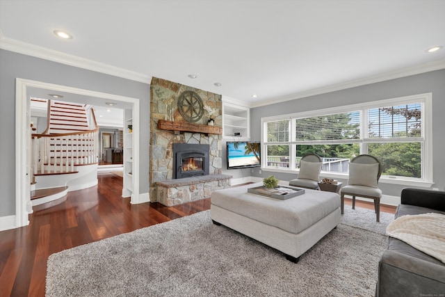 65 Joes Hill Rd, Danbury, CT 06811 - living area featuring wood finished floors, crown molding, a stone fireplace, recessed lighting, and built in features
