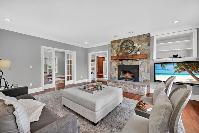 65 Joes Hill Rd, Danbury, CT 06811 - living area with wood finished floors, ornamental molding, a fireplace, recessed lighting, and built in features