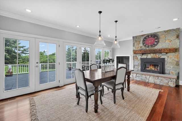 65 Joes Hill Rd, Danbury, CT 06811 - dining space with french doors, ornamental molding, wood finished floors, a fireplace, and recessed lighting