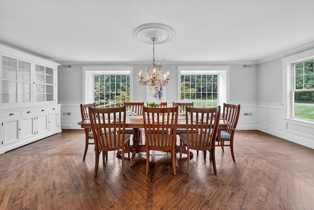 65 Joes Hill Rd, Danbury, CT 06811 - dining room with a chandelier, crown molding, a decorative wall, and wainscoting