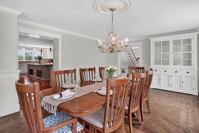 65 Joes Hill Rd, Danbury, CT 06811 - dining area featuring a chandelier, dark wood finished floors, ornamental molding, a decorative wall, and wainscoting
