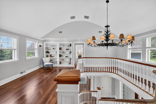 65 Joes Hill Rd, Danbury, CT 06811 - stairway with vaulted ceiling, built in features, wood finished floors, arched walkways, and a chandelier
